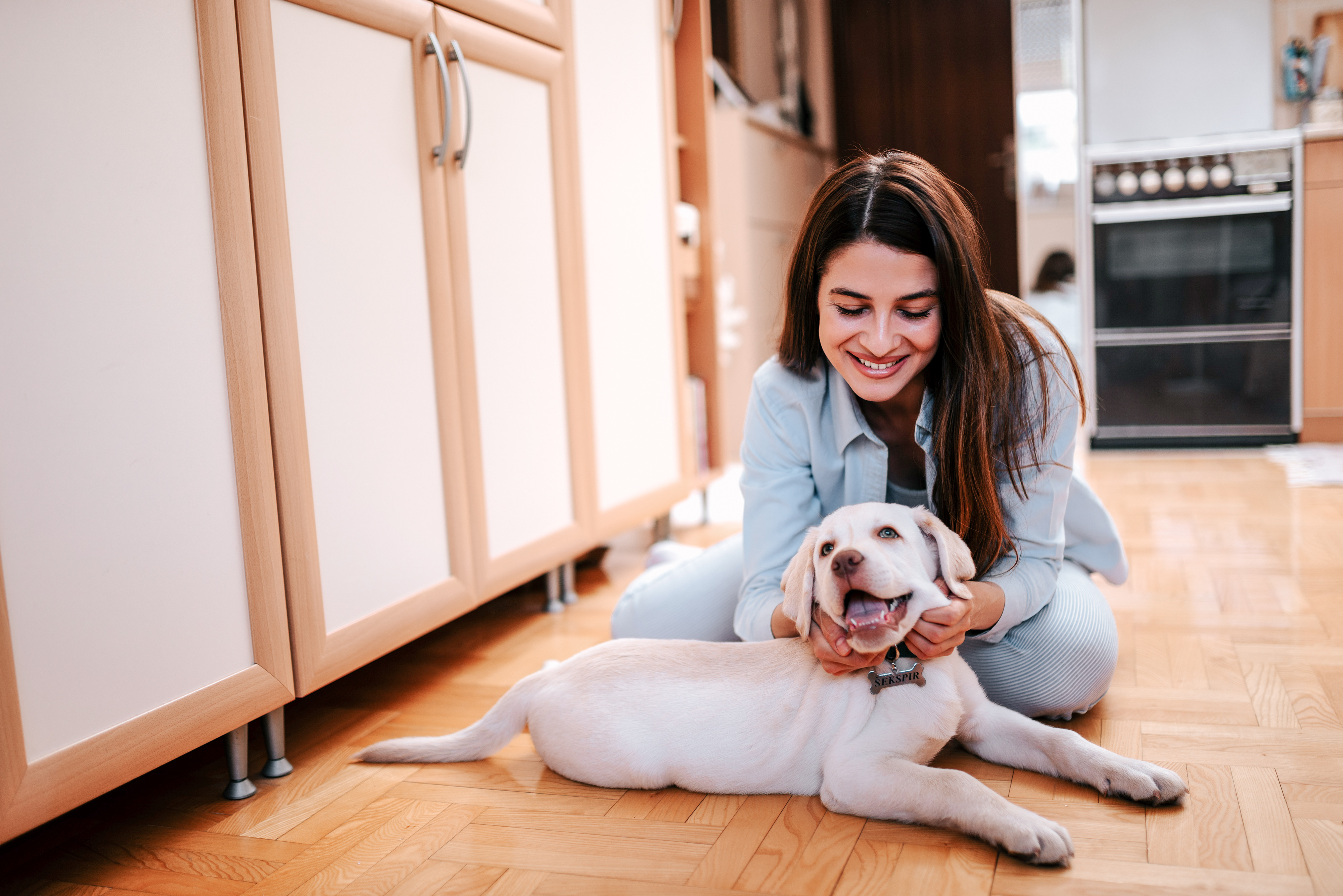 woman with cute puppy who just got a class act share certificate