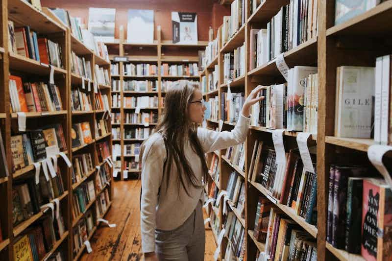 woman picking excellent book