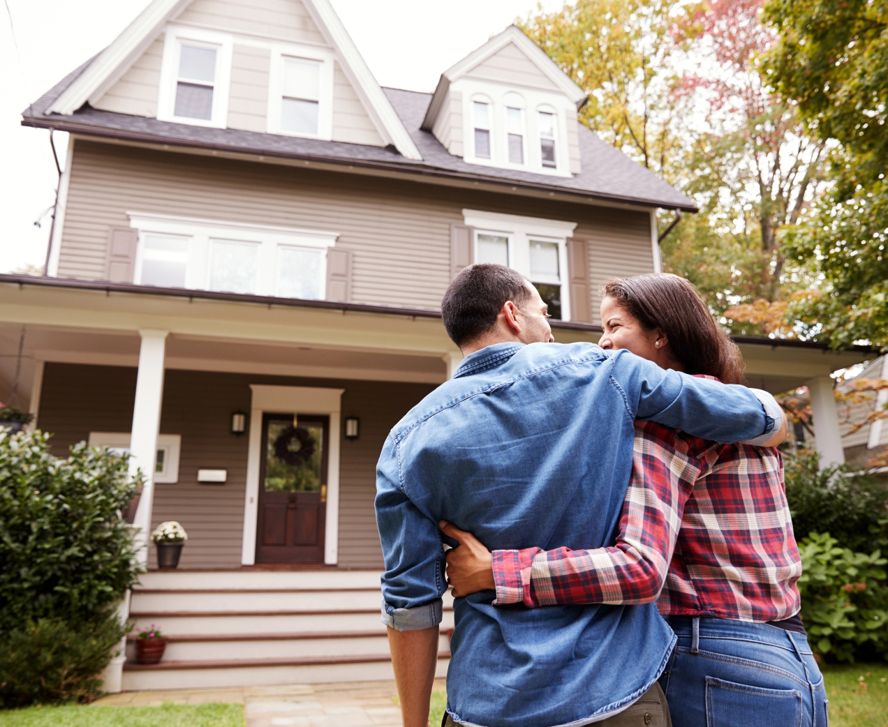 Man And Woman Walking Into House