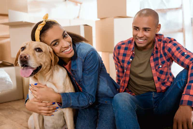 couple with labrador getting a Class Act mortgage loan